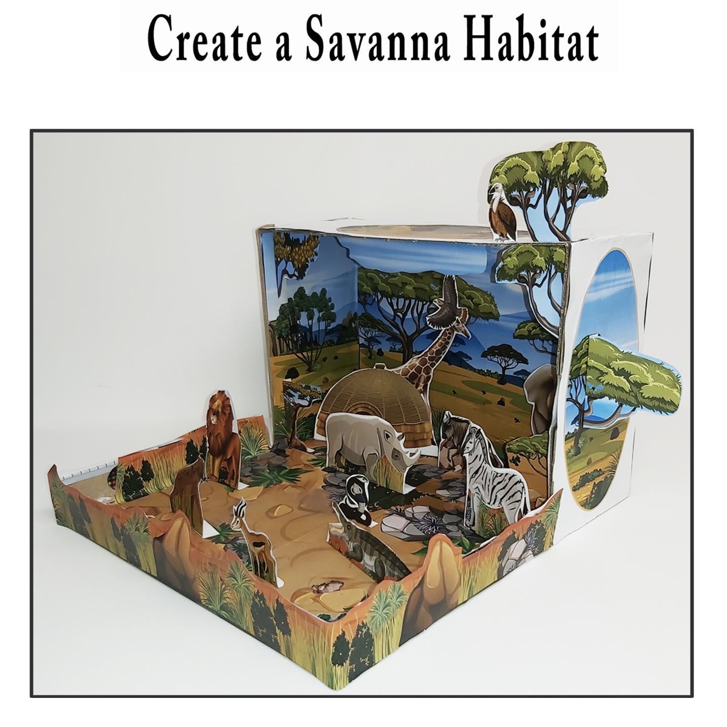 Maqueta de sabana 3D construida en una caja con animales africanos y paisaje de papel